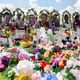 A memorial for the supermarket shooting victims is set up outside the Tops Friendly Market on Thursday, July 14, 2022, in Buffalo, N.Y. N.Y. The Buffalo supermarket where 10 Black people were killed by a white gunman is set to reopen its doors, two months after the racist attack.